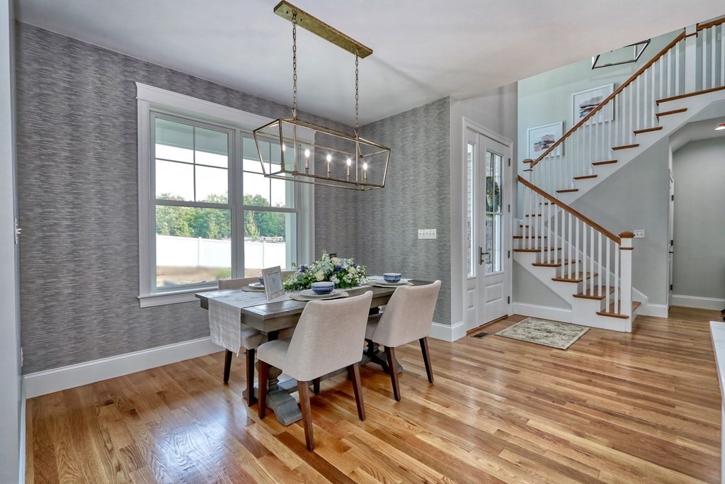 73 Rowell Road, Unit 73 Middleton , MA 01923 - Photo 11 of 40 a view of a dining room with furniture window and wooden floor