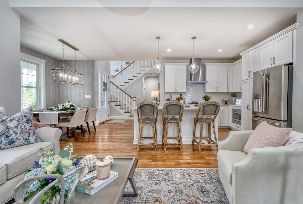 73 Rowell Road, Unit 73 Middleton , MA 01923 - Photo 15 of 40 a living room with lots of furniture and kitchen view