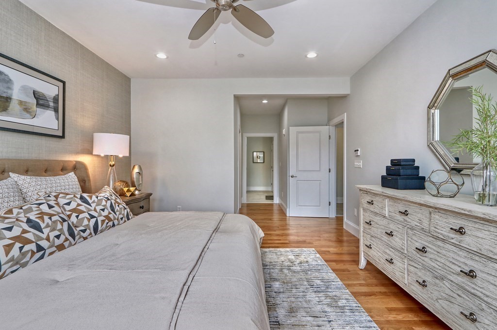 73 Rowell Road, Unit 73 Middleton , MA 01923 - Photo 19 of 40 a spacious bedroom with a large bed and a dresser