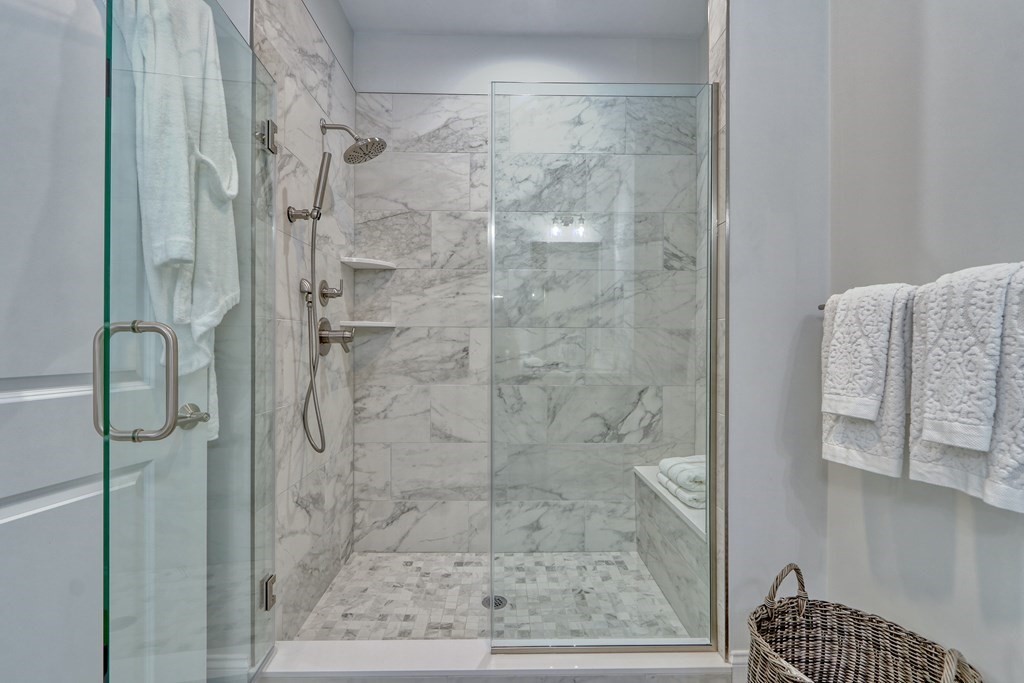 73 Rowell Road, Unit 73 Middleton , MA 01923 - Photo 22 of 40 a bathroom with a glass shower door