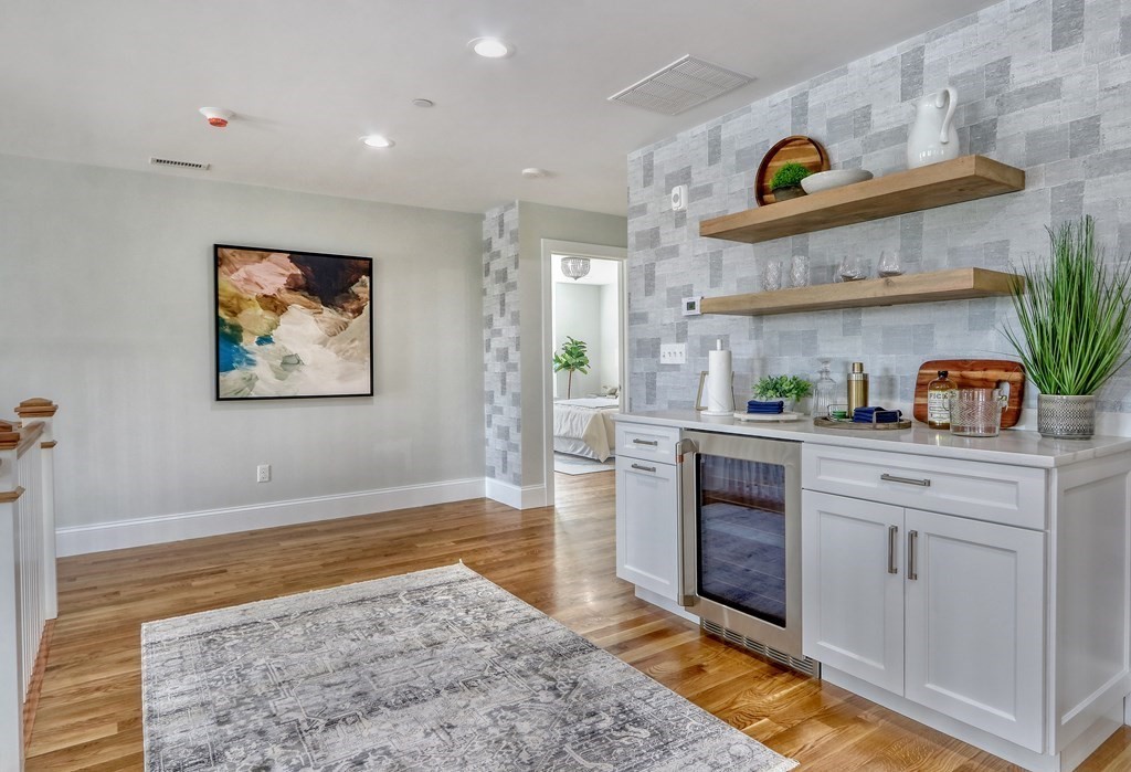 73 Rowell Road, Unit 73 Middleton , MA 01923 - Photo 24 of 40 a kitchen with stainless steel appliances granite countertop a stove a sink and a refrigerator