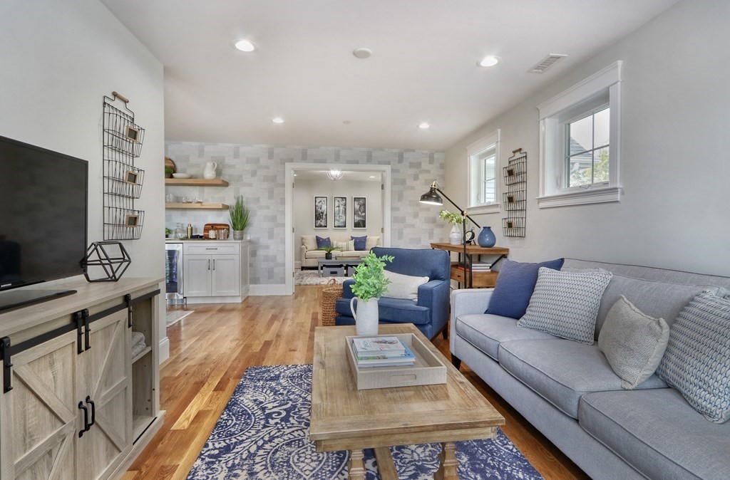 73 Rowell Road, Unit 73 Middleton , MA 01923 - Photo 25 of 40 a living room with furniture and a flat screen tv