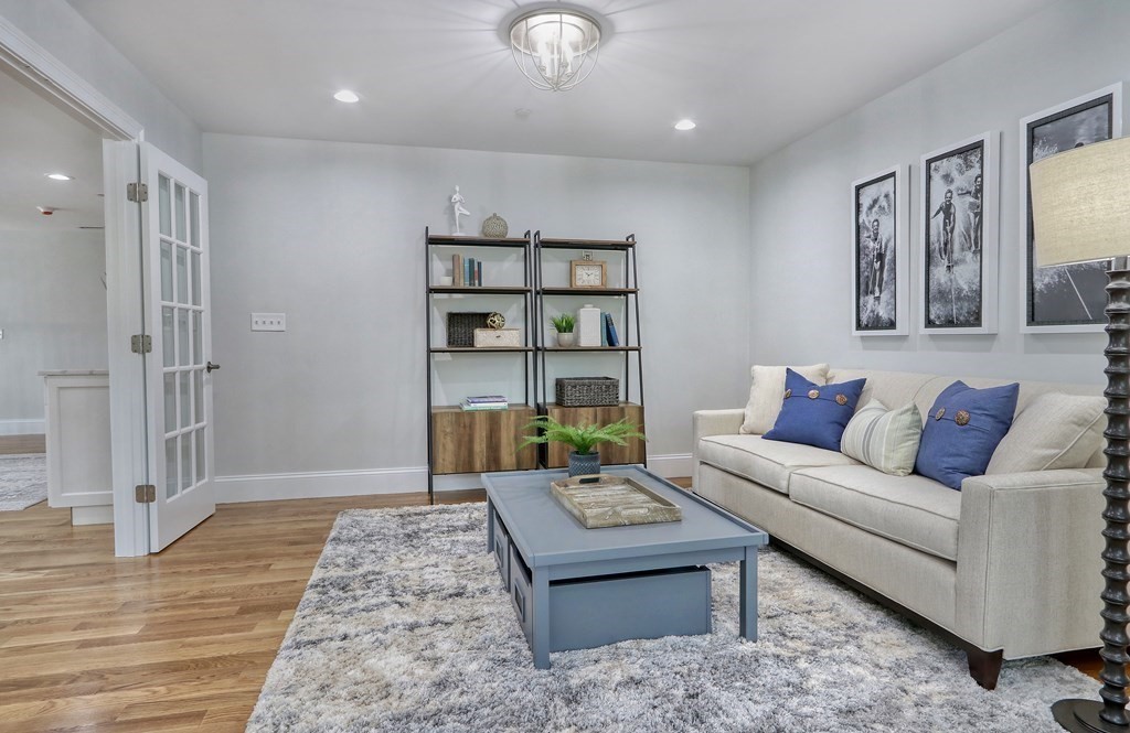 73 Rowell Road, Unit 73 Middleton , MA 01923 - Photo 28 of 40 a living room with furniture and a rug