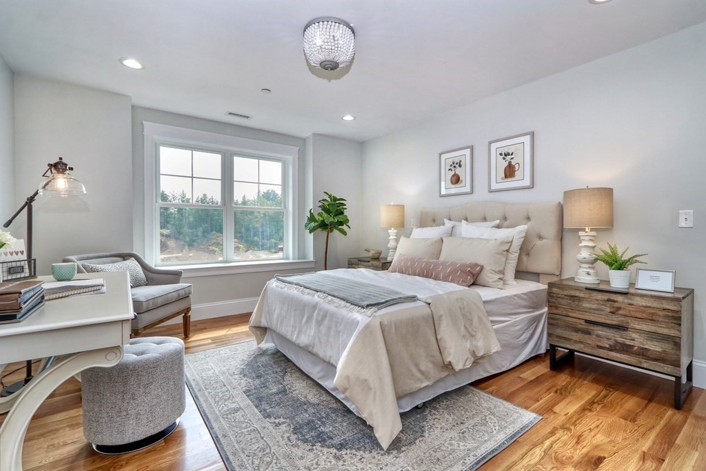 73 Rowell Road, Unit 73 Middleton , MA 01923 - Photo 30 of 40 a bedroom with a bed and a couch