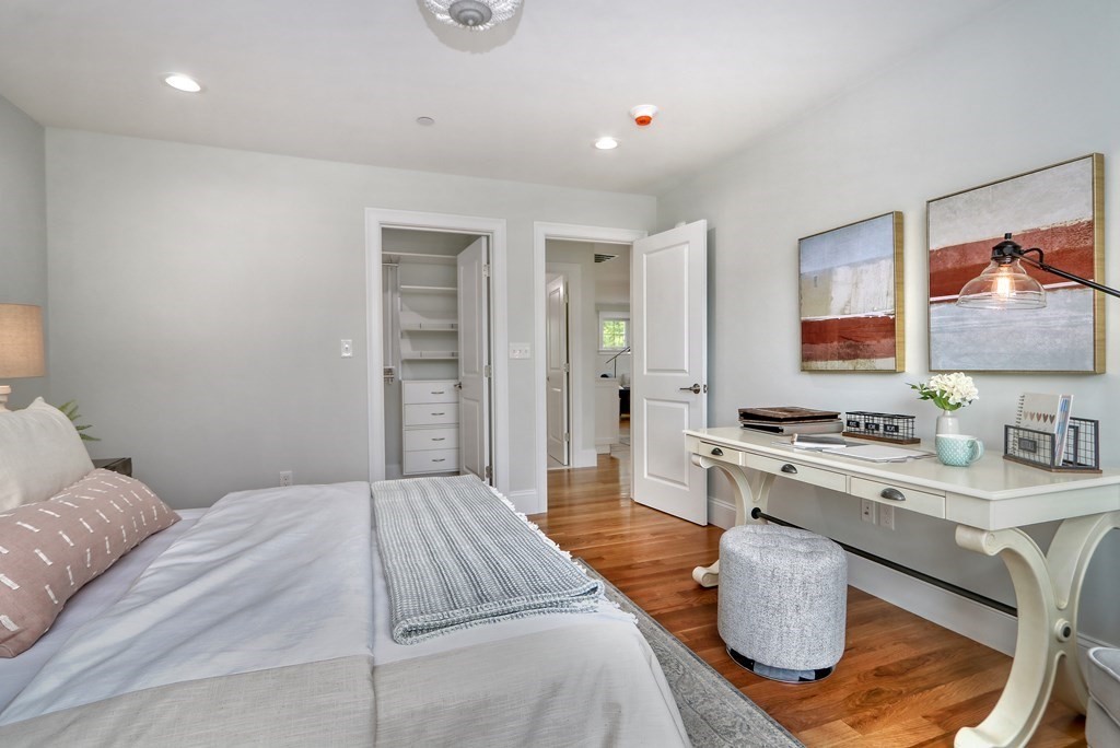 73 Rowell Road, Unit 73 Middleton , MA 01923 - Photo 31 of 40 a bedroom with a bed and a desk