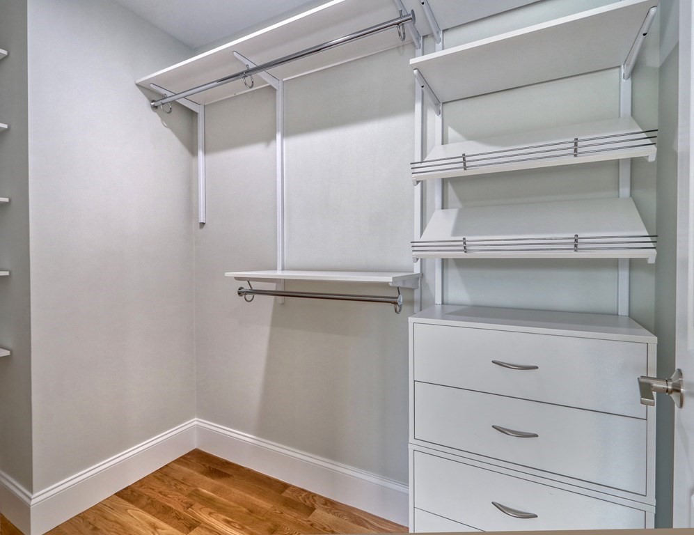 73 Rowell Road, Unit 73 Middleton , MA 01923 - Photo 33 of 40 a view of walk in closet with empty racks