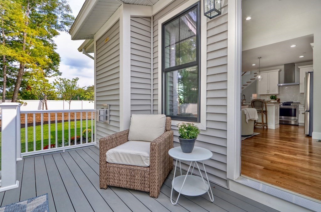 73 Rowell Road, Unit 73 Middleton , MA 01923 - Photo 35 of 40 a view of a patio with couches table and chairs and potted plants