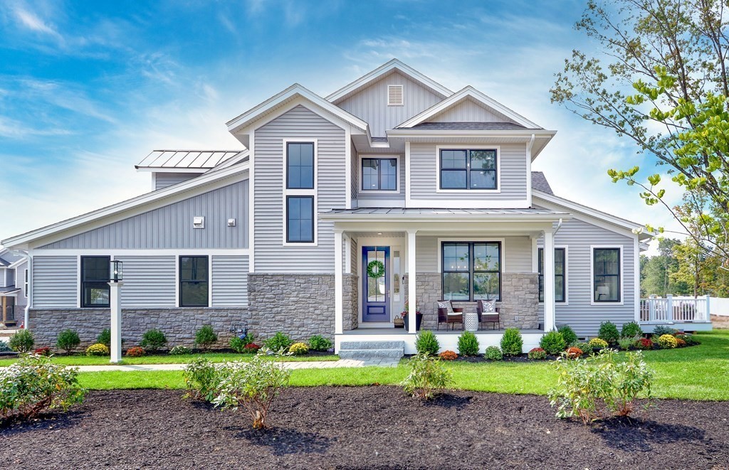 73 Rowell Road, Unit 73 Middleton , MA 01923 - Photo 4 of 40 a front view of a house with garden and porch