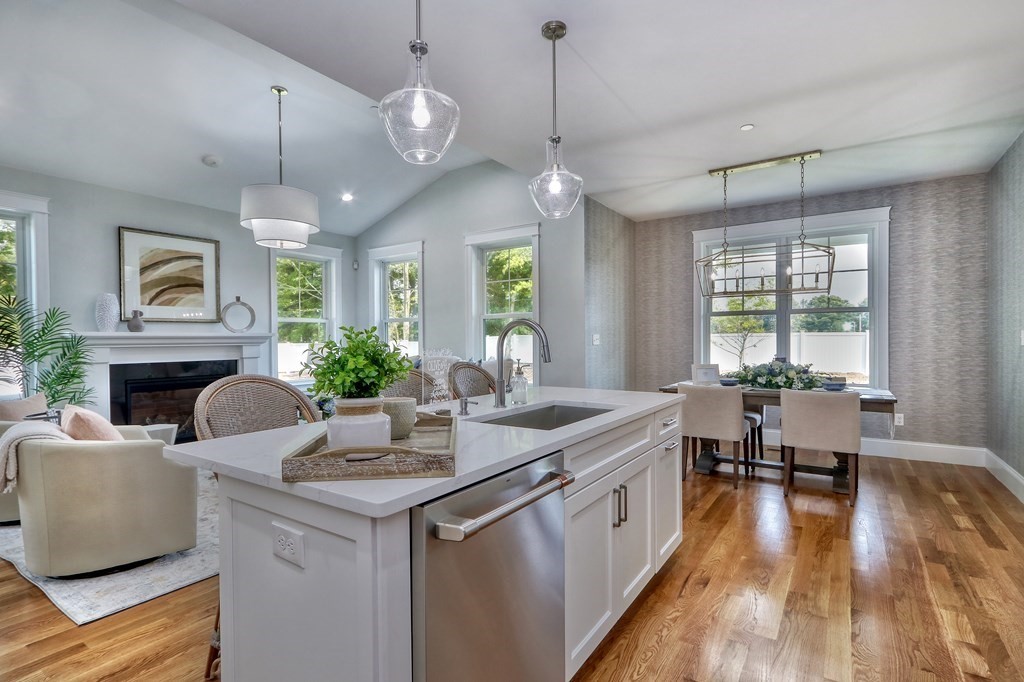 73 Rowell Road, Unit 73 Middleton , MA 01923 - Photo 8 of 40 a kitchen with sink stove and living room