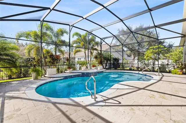 a view of a swimming pool with a patio