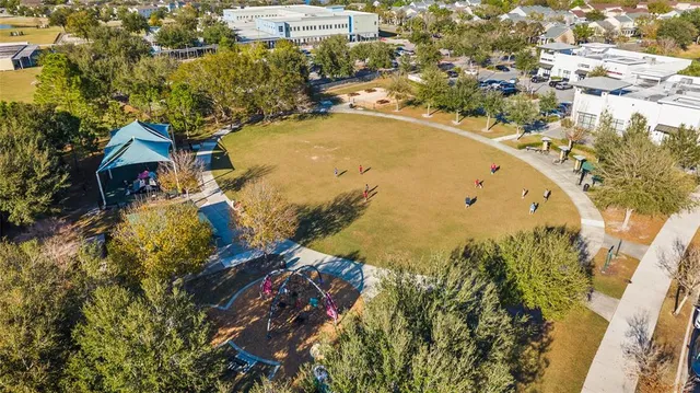 an aerial view of residential houses with outdoor space