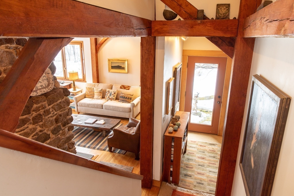 45 Sessions Road Hardwick, MA 01037 - Photo 11 of 28 a living room with furniture and a floor to ceiling window