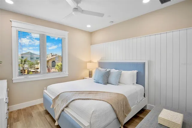 a bathroom with a sink a mirror a toilet and shower