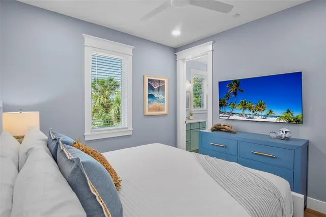 a view of a roof deck with table and chairs a barbeque with wooden floor and fence