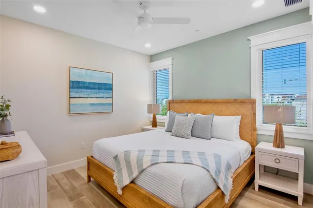 a bathroom with a granite countertop sink a toilet and a mirror