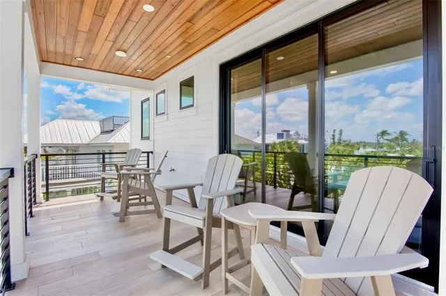 a bed room with a bed and a large window