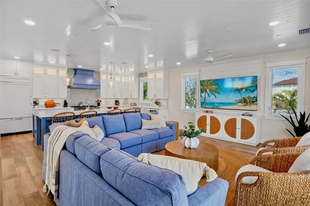 a kitchen with stainless steel appliances a sink a stove and cabinets