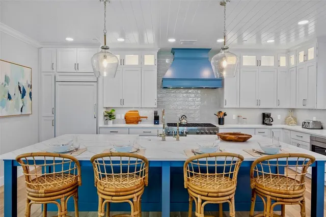 a dining room with furniture a window and wooden floor