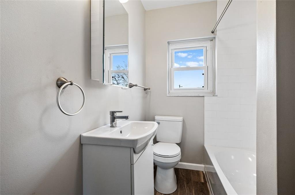 800 State Street Duquesne, PA 15110 - Photo 13 of 27 a bathroom with a toilet sink and mirror