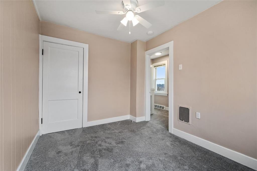 800 State Street Duquesne, PA 15110 - Photo 16 of 27 an empty room with fan and entrance