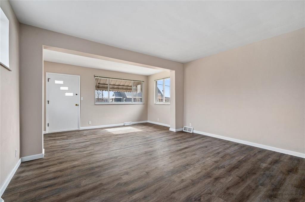 800 State Street Duquesne, PA 15110 - Photo 5 of 27 wooden floor in an empty room with a window