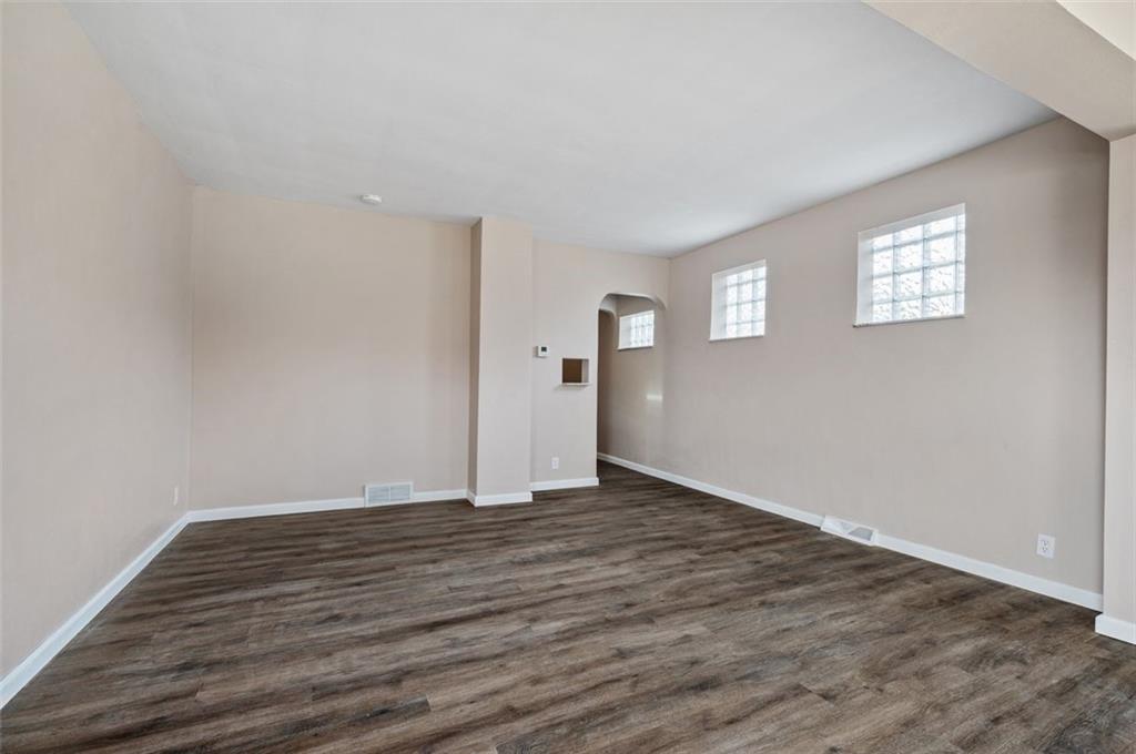 800 State Street Duquesne, PA 15110 - Photo 7 of 27 a view of an empty room with wooden floor and a window