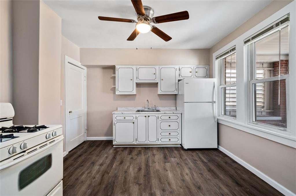 800 State Street Duquesne, PA 15110 - Photo 8 of 27 a kitchen with white cabinets and white appliances