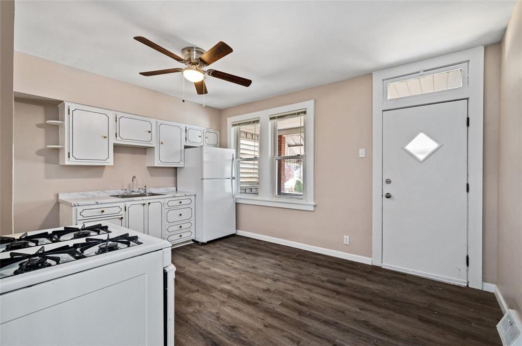 800 State Street Duquesne, PA 15110 - Photo 9 of 27 a kitchen with stainless steel appliances a stove a sink and a refrigerator