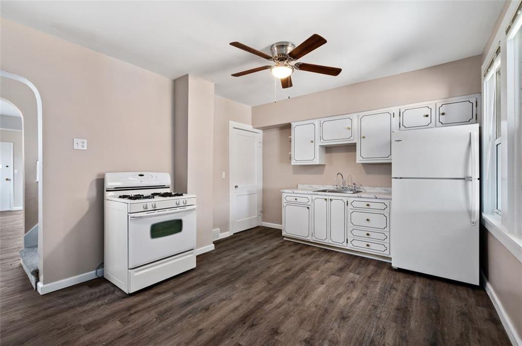 800 State Street Duquesne, PA 15110 - Photo 10 of 27 a kitchen with stainless steel appliances a stove a sink and a refrigerator