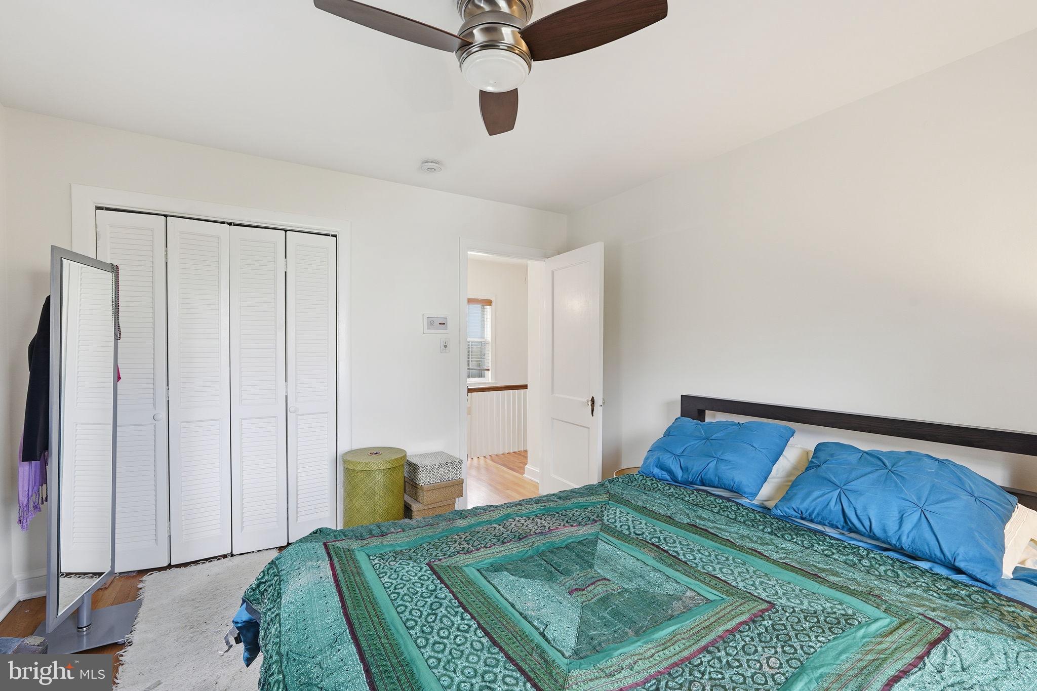 8209 Meadowbrook Lane Chevy Chase, MD 20815 - Photo 17 of 24 a bedroom with a bed and painted walls