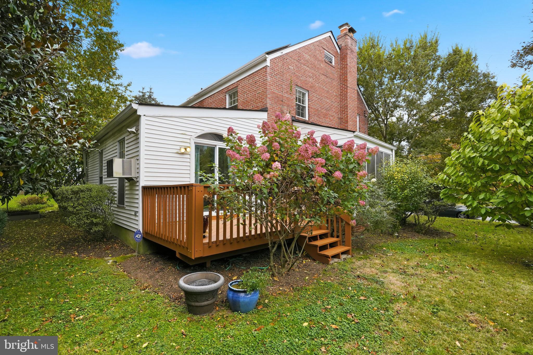 8209 Meadowbrook Lane Chevy Chase, MD 20815 - Photo 21 of 24 a view of a chair and table in backyard of the house