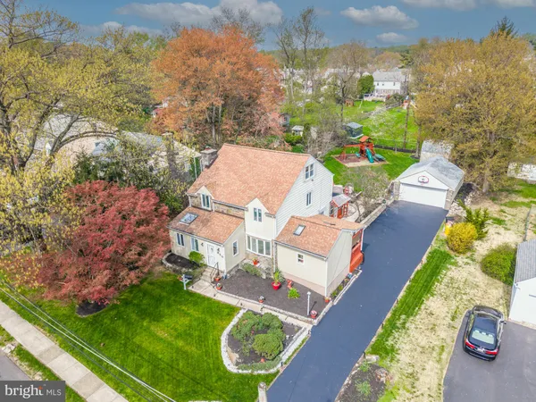 an aerial view of a house with a garden