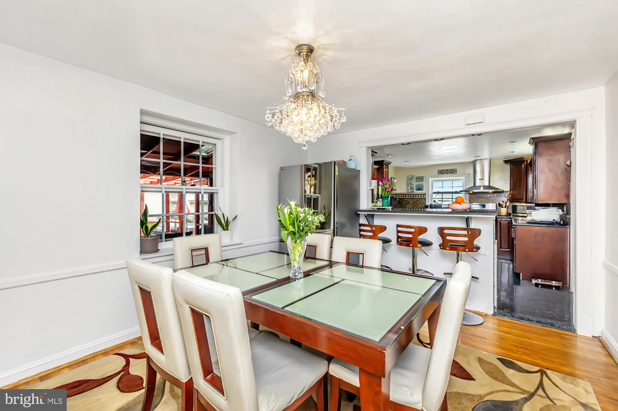 320 Prospect Road Springfield, PA 19064 - Photo 12 of 78 a view of a dining room with furniture and a chandelier