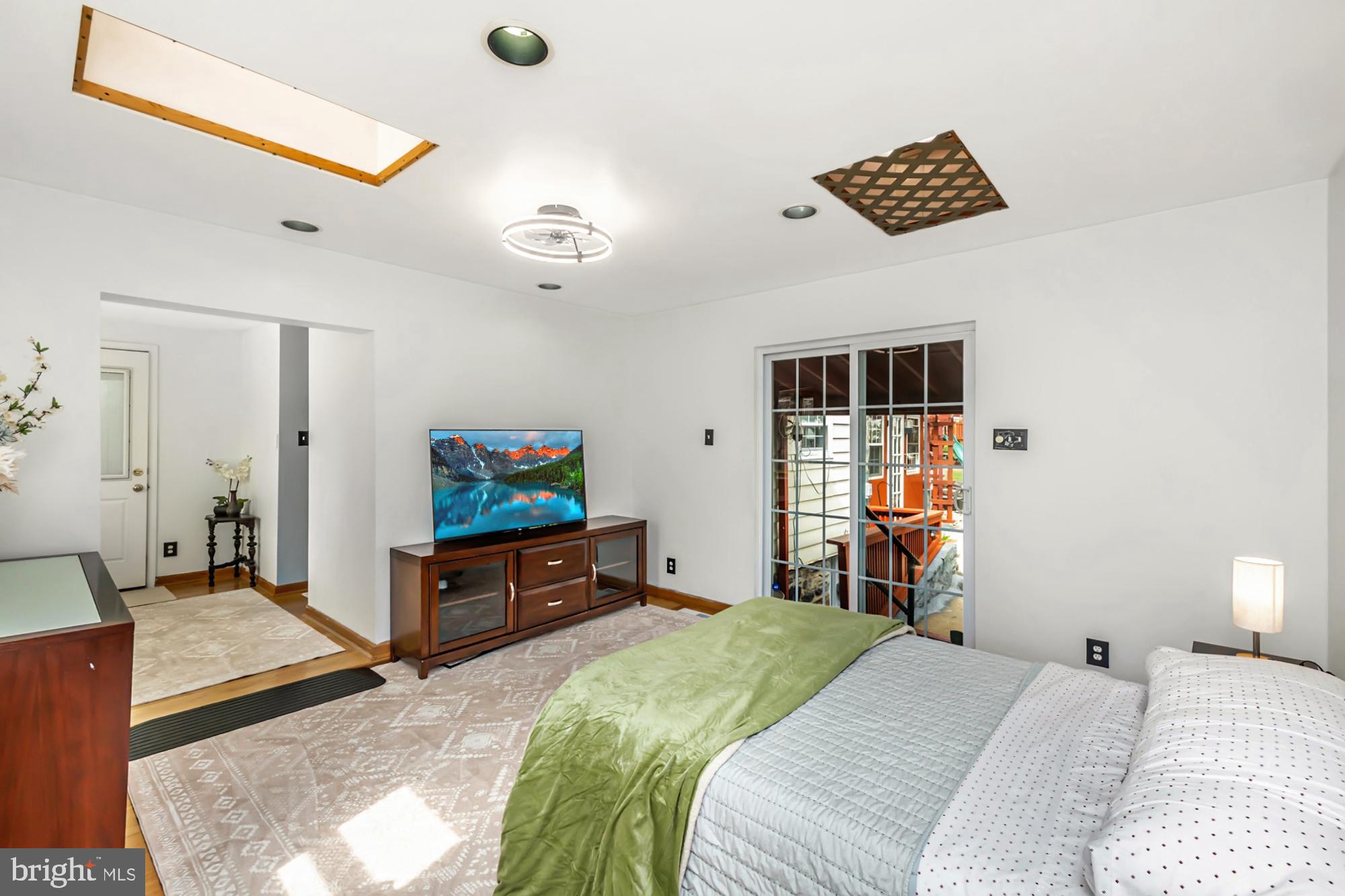 320 Prospect Road Springfield, PA 19064 - Photo 21 of 78 a bedroom with a bed and a flat screen tv