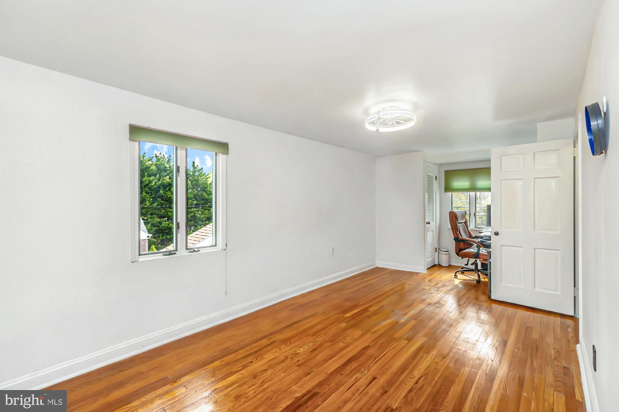320 Prospect Road Springfield, PA 19064 - Photo 38 of 78 a view of empty room with wooden floor and fan