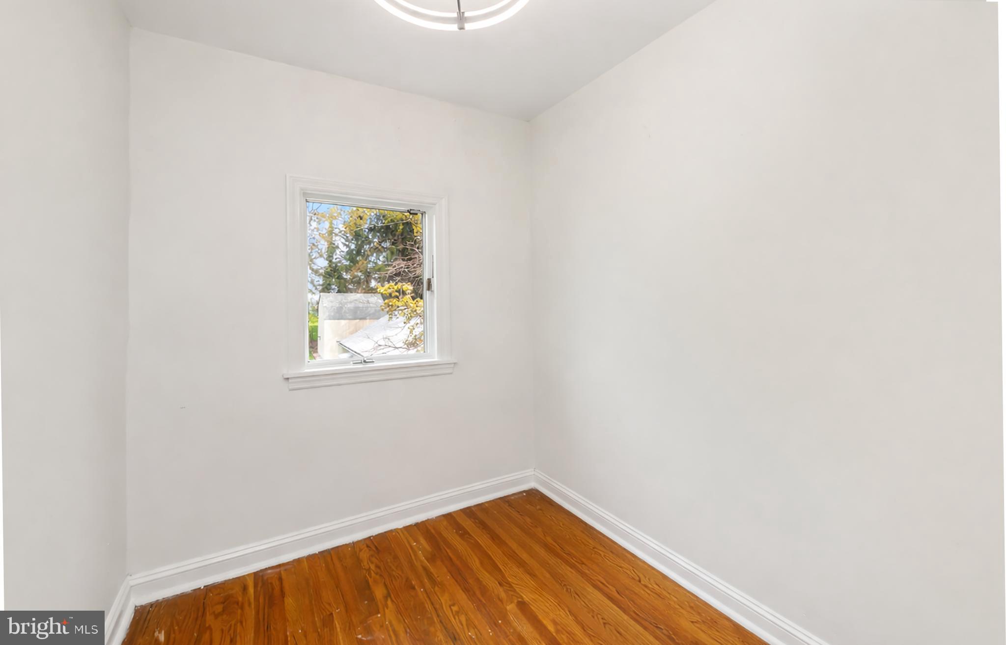 320 Prospect Road Springfield, PA 19064 - Photo 42 of 78 a view of a small space with wooden floor and a window