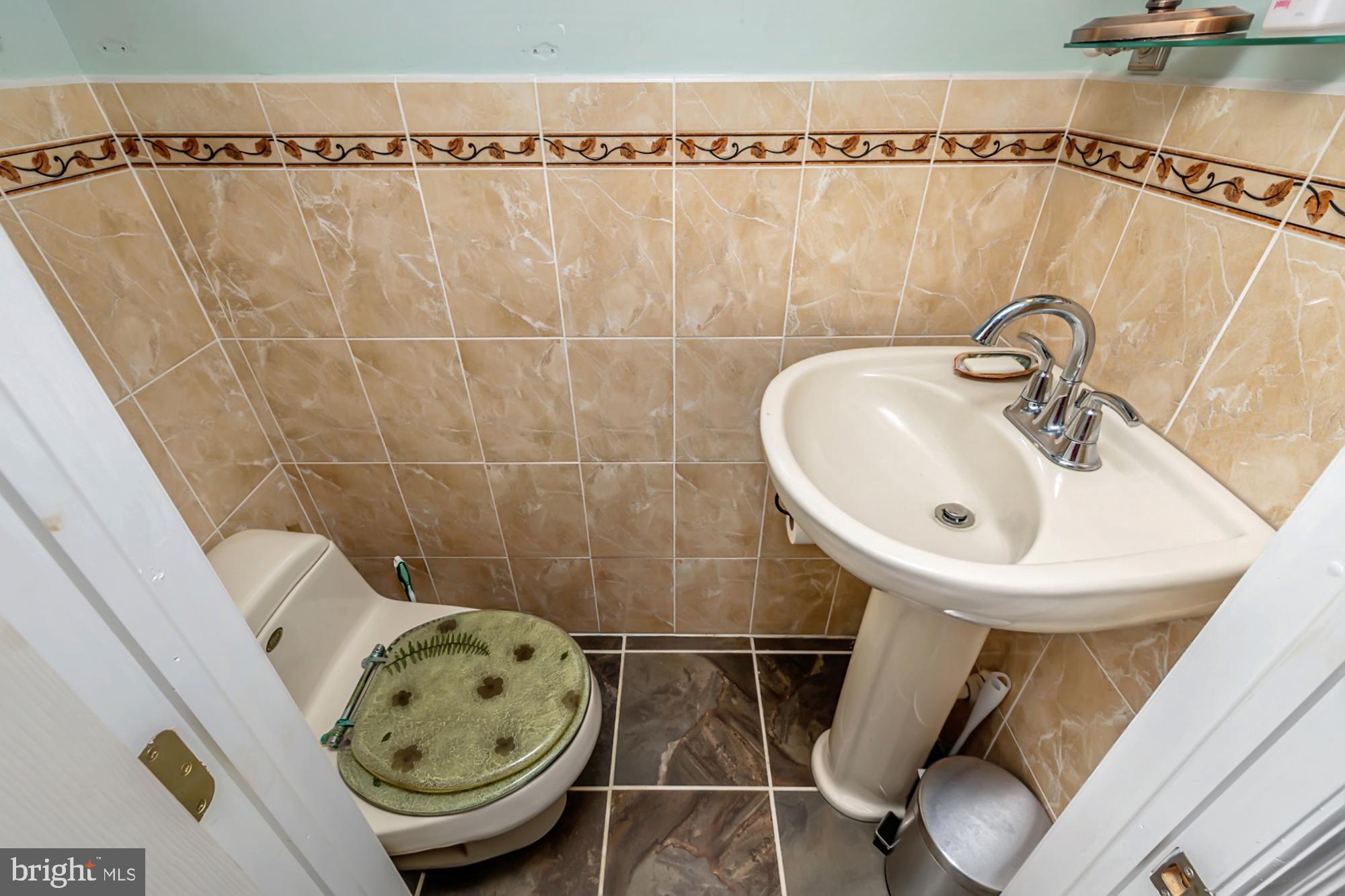 320 Prospect Road Springfield, PA 19064 - Photo 52 of 78 a bathroom with a sink and a mirror