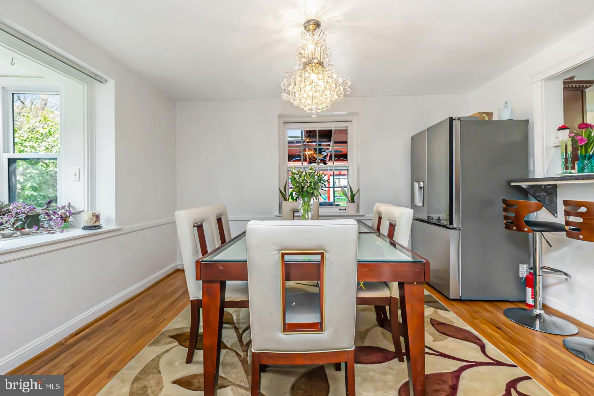 320 Prospect Road Springfield, PA 19064 - Photo 10 of 78 a view of a dining room with furniture and a chandelier