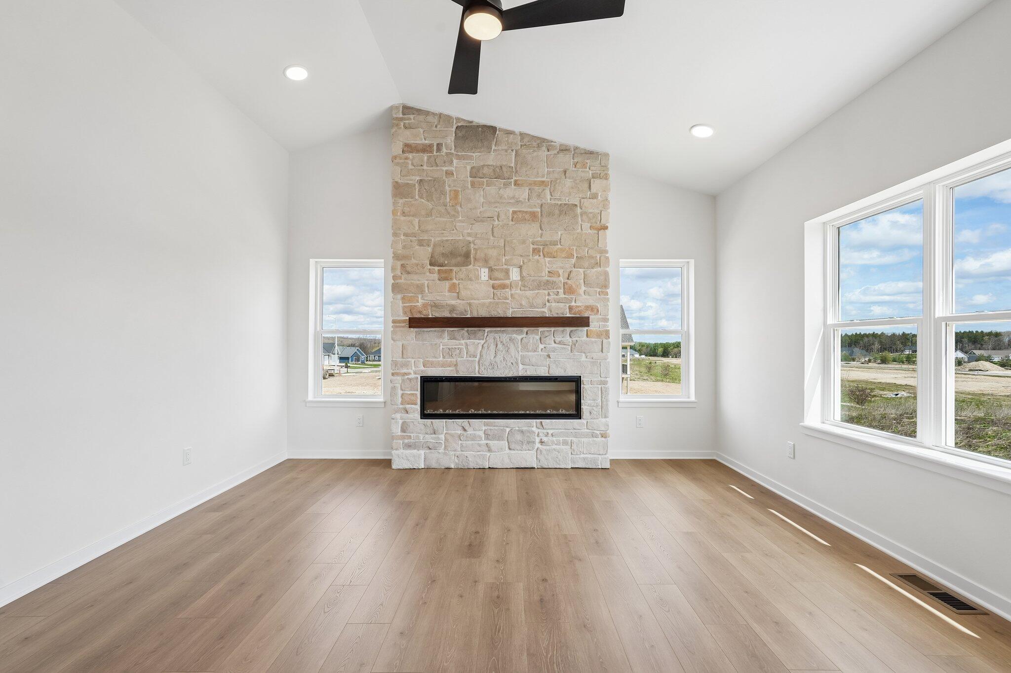 438 Sandstone Street Slinger, WI 53086 - Photo 6 of 29 Great Room w/ Electric Fireplace