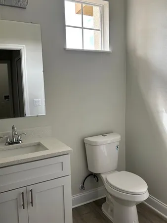 a view of a small space with wooden floor