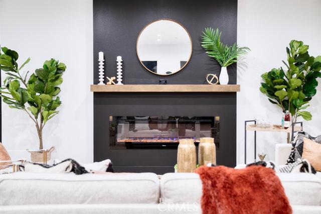 20362 Plaina Road Apple Valley, CA 92307 - Photo 11 of 29 a living room with furniture and a potted plant