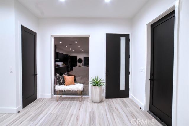 20362 Plaina Road Apple Valley, CA 92307 - Photo 15 of 29 a bedroom with wooden floor and a bed