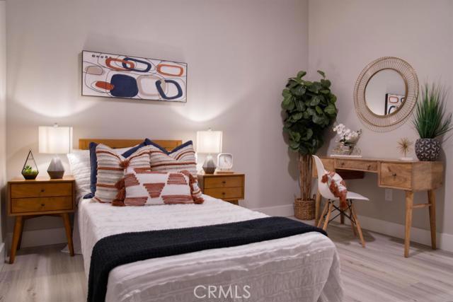 20362 Plaina Road Apple Valley, CA 92307 - Photo 26 of 29 a bedroom with a bed and a table in it