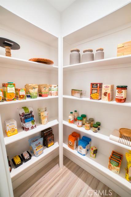 20362 Plaina Road Apple Valley, CA 92307 - Photo 8 of 29 a cabinet with stainless steel appliances lots of different kinds of food