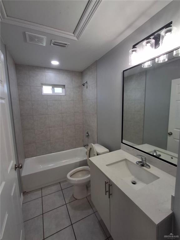 2104 Multi National, Unit C Harlingen, TX 78550 - Photo 10 of 14 a bathroom with a sink a toilet a mirror and shower