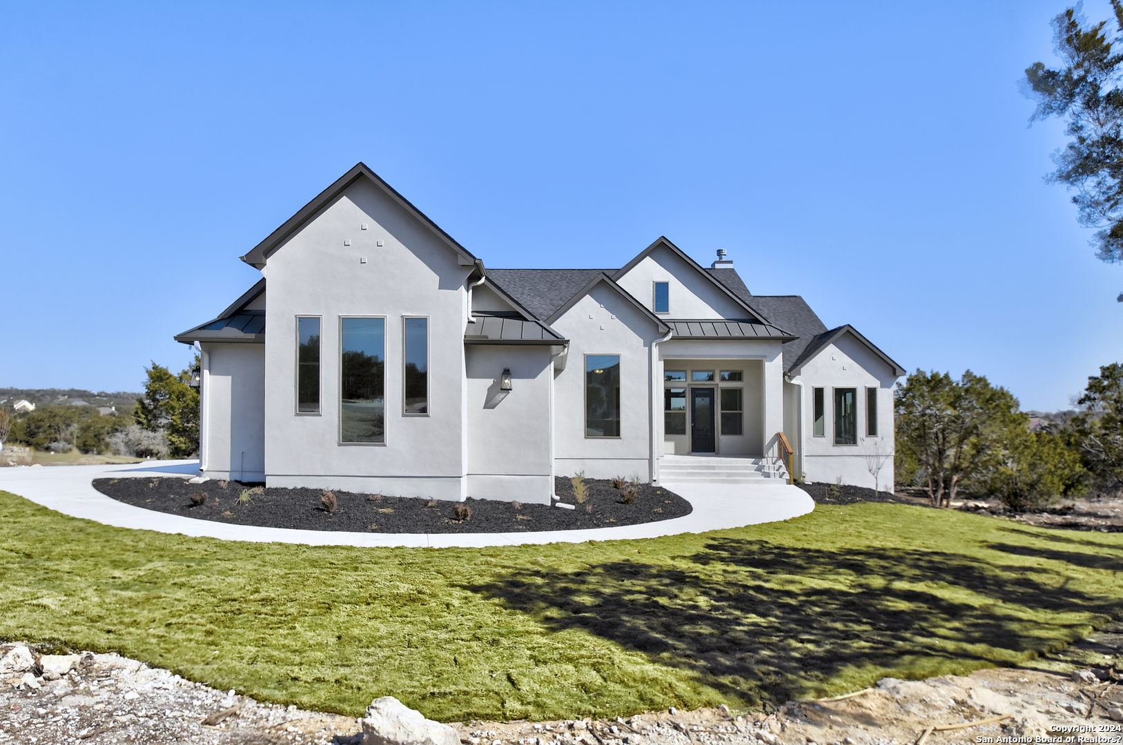 a front view of a house with a yard