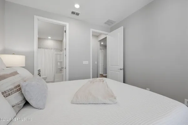 a utility room with cabinets washer and dryer
