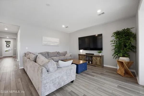 a large kitchen with a table and chairs in it