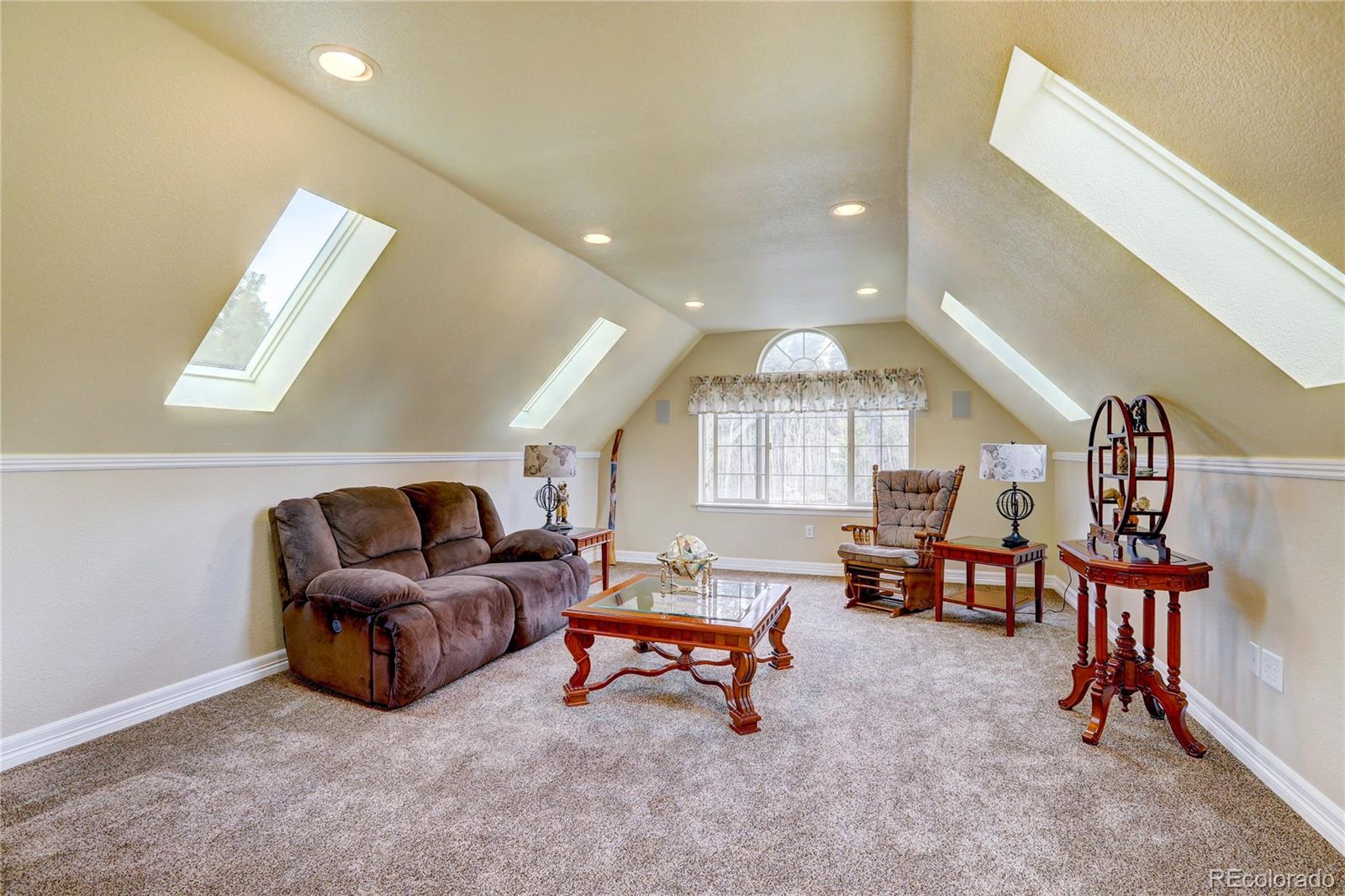 634 Foxtail Circle Black Hawk, CO 80422 - Photo 16 of 40 a living room with furniture and a large window