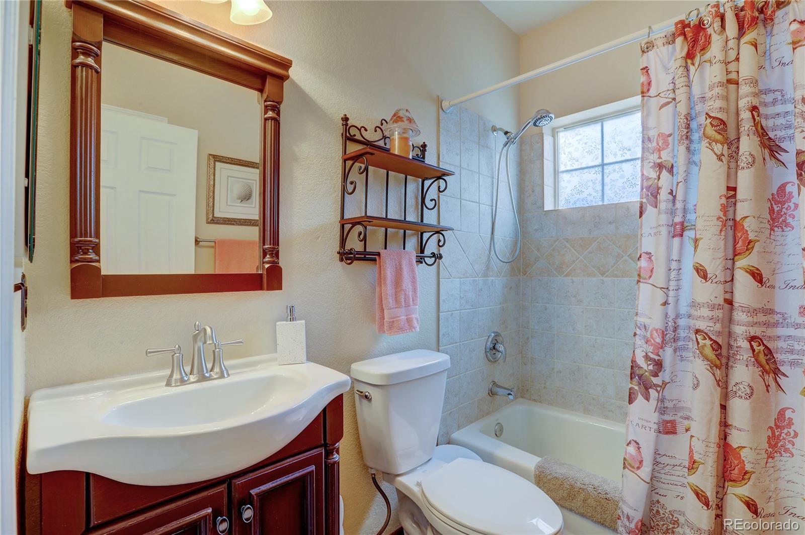 634 Foxtail Circle Black Hawk, CO 80422 - Photo 18 of 40 a bathroom with a sink toilet and shower